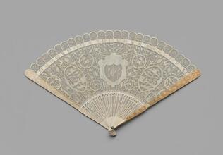 Folding fan of pierced and carved ivory with original box