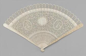 Brisé fan of pierced ivory with original box