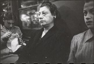 Life and Love on the New York City Subway [Women riding the subway.]