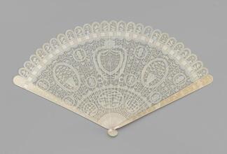 Brisé fan of pierced and carved ivory with original lacquer fan box