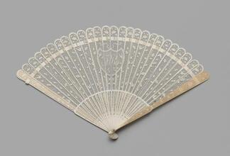 Folding fan of carved and pierced ivory