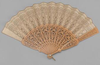 Folding fan of pierced linen