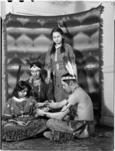 [Native Americans in traditional clothing.]