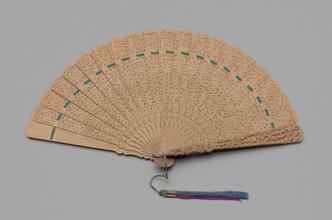 Folding fan of carved sandalwood with original box