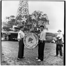 [Men holding a drum for the Lebanon League of Progress of New York.]