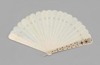 Brisé ivory fan with jeweled guards