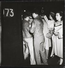 Life and Love on the New York City Subway [Passengers trying to board a crowded subway car.]