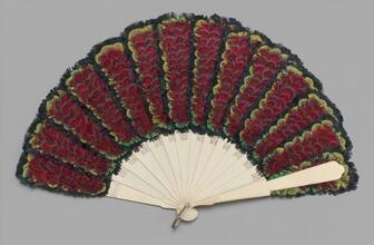 Folding feathered fan of iridescent feathers