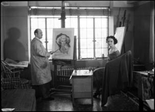 [East 41st Street and Tudor City Place. Tudor City. Interior, artist's studio with artist and model.]