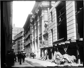 "Clearance Building" [under construction, pedestrians looking on]