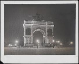 [Grand Army Plaza at night.]