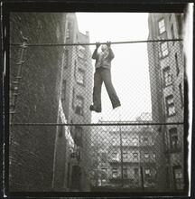 Shoe Shine Boy [Mickey climbing a fence.]