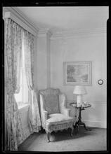 Carroll Carstairs [residence]. Living room chair and Renoir painting.