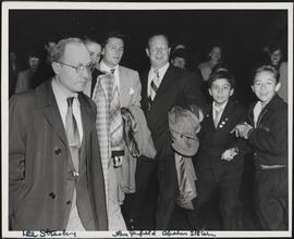 [Lee Strasberg, John Garfield and Abraham Ellstein in a group of people.]