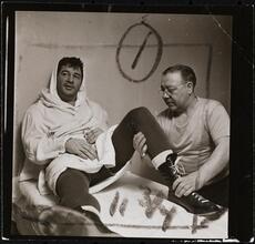 Rocky Graziano, He's a Good Boy Now [Man massaging Rocky Graziano's leg.]