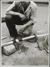 East 58th Street. Street opening, wiping joint of lead pipe on street