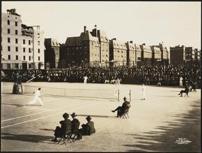 Tennis Tournament. Japanese Relief. View showing Tilden playing Alonzo. Chateau Apartments in background