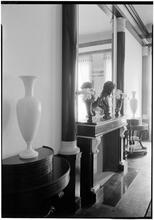Elsie Cobb Wilson, Inc. Black and white room. Sharp vertical detail of fireplace.