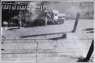 [Placing truss on trailer.]