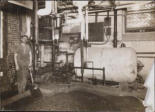 [Worker in the basement of the Rivington Street public baths.]