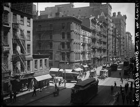 Broadway Series. View of west side of Bway looking north from Bleecker Street. Ligget's Drugstore on the near corner at left. On the far corner is No. 463, with I. Moss' Hats sign on 2nd floor.
