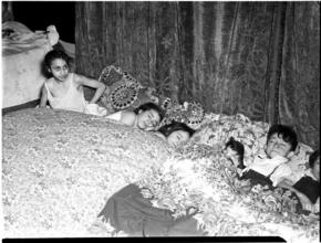 [Children in bed.]