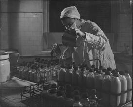 St. John's Hospital, Filling Infant Formula Bottles by Hand.