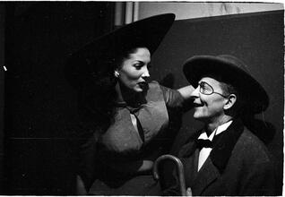 Show Girl [Rosemary talking to a man in costume.]