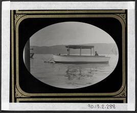 [Small boat anchored in the lake.]