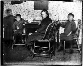 Children in "The Ship," destroyed by B. of Health in 1897, after the visit of Roosevelt & myself [Jacob A. Riis] there.
