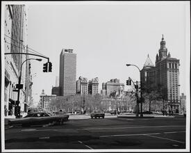 [Looking north from the intersection of Broadway, Park Row, Vesey Street, and Ann Street.]