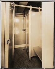 [Interior, locker room shower stall.]
