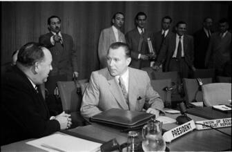United Nations [Nasrollah Entezam talking to an unidentified man at the General Assembly of the United Nations.]