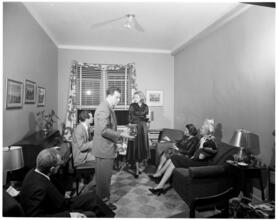 Fashion Models: Lisa Fonssagrives [Meg Mundy hosting a get-together at home.]