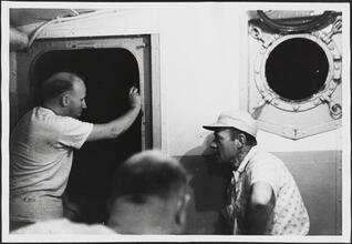 [Crew members on the ferry.]