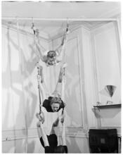 Fashion Models: Lisa Fonssagrives [Meg Mundy and two other woman using gymnastics rings.]