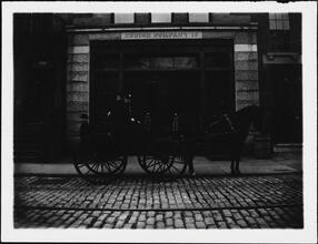 [Horse-drawn carriage outside of the station for Engine Company 18.]