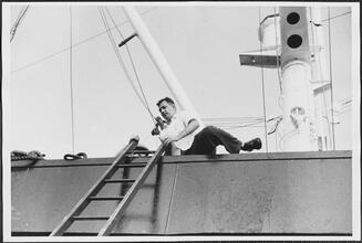 [Crew member on the ferry.]