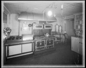 228 East 21st Street. House of Consolation, kitchen showing gas range, plate warmer with steam table, coffee and tea urns and hot table.