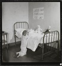 Orphanage [Girl praying.]