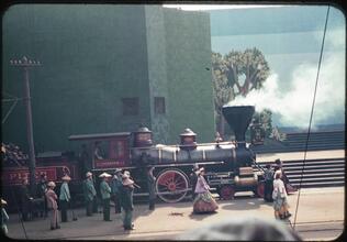 [Actors with a replica of the Jupiter locomotive during the Parade of Railroads show.]