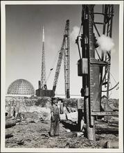From the Mud (Pile drives on General Motors [Building])