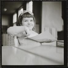 Orphanage [Girl holding a drawing.]