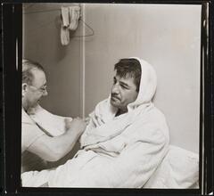 Rocky Graziano, He's a Good Boy Now [Man massaging Rocky Graziano's arm.]