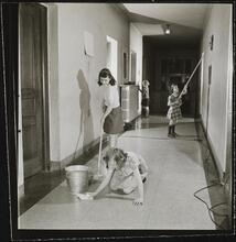 Orphanage [Girls cleaning a hallway.]