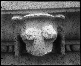 University Club. Animal head motif on stone cornice.