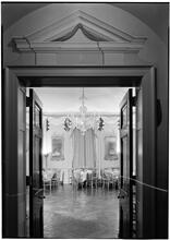Vincent Astor [residence]. General view decorated living room thru door, candles lighted.