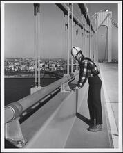Verrazano Narrows Bridge. Worker at handrail