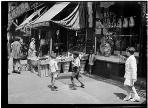 Children in front of the Jersey Pork Store, Harlem.