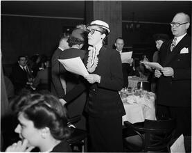 Dale Carnegie [Student leads class song at graduation exercise.]